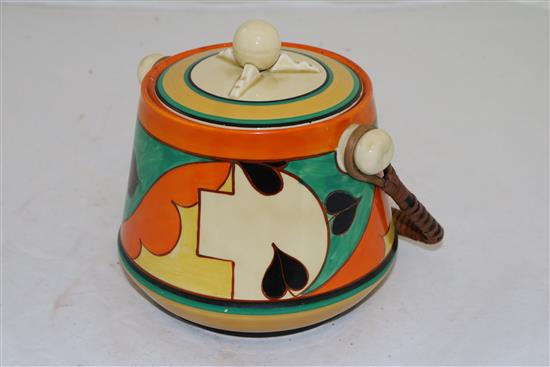 A Clarice Cliff Feather and Leaves pattern biscuit barrel, height to finial 16.5cm (6.5in.)